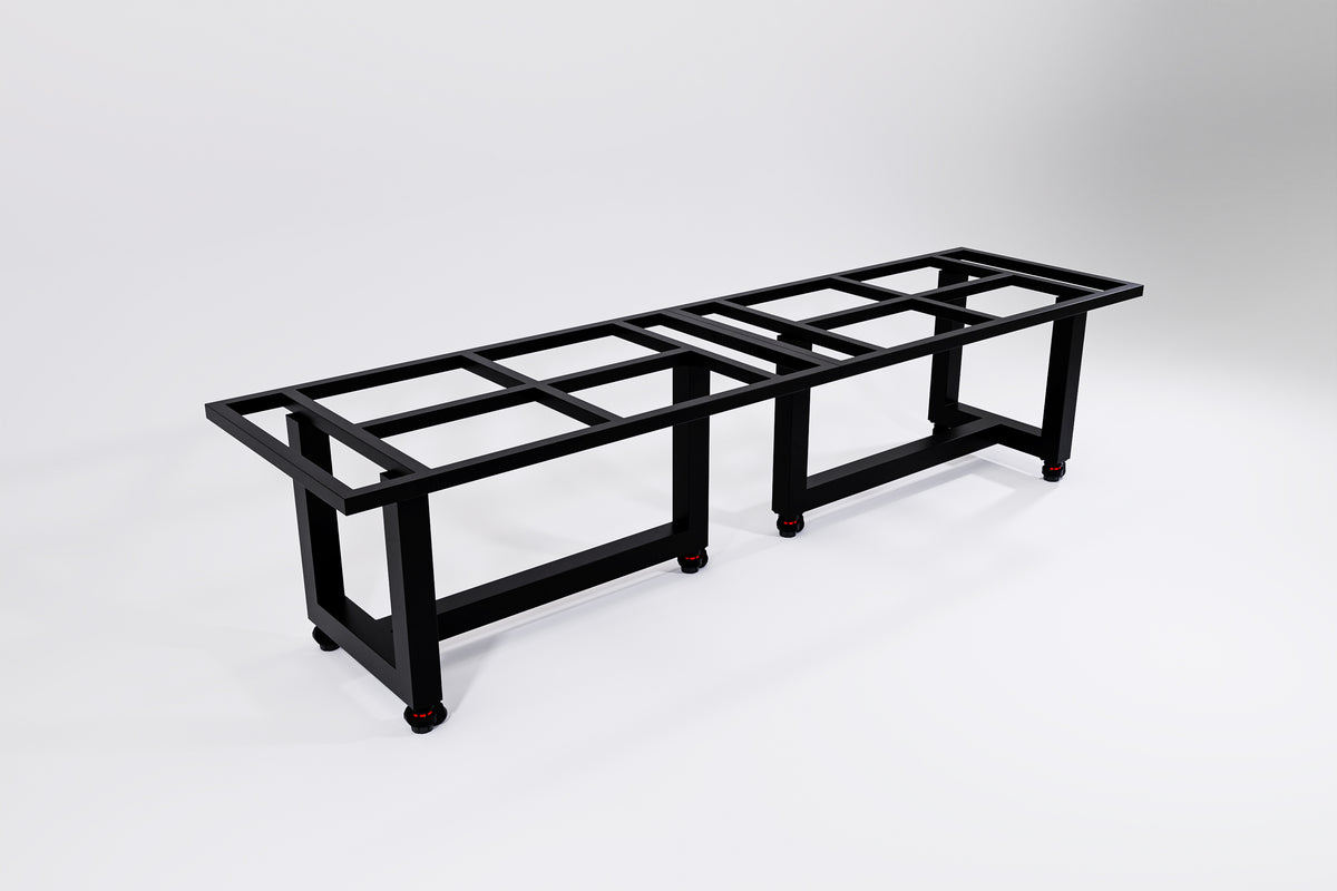 A heavy duty black metal table on wheels