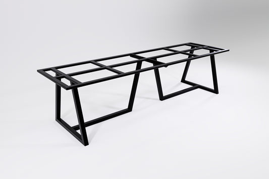 A black modular heavy-duty table base designed to be bolted together, consisting of two sections with table leg supports