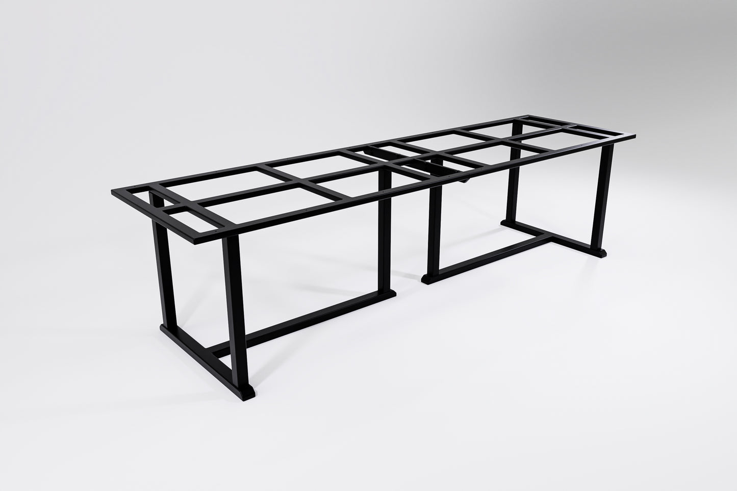 A long and wide metal table frame with traditional handcrafted details designed to hold a heavy stone top