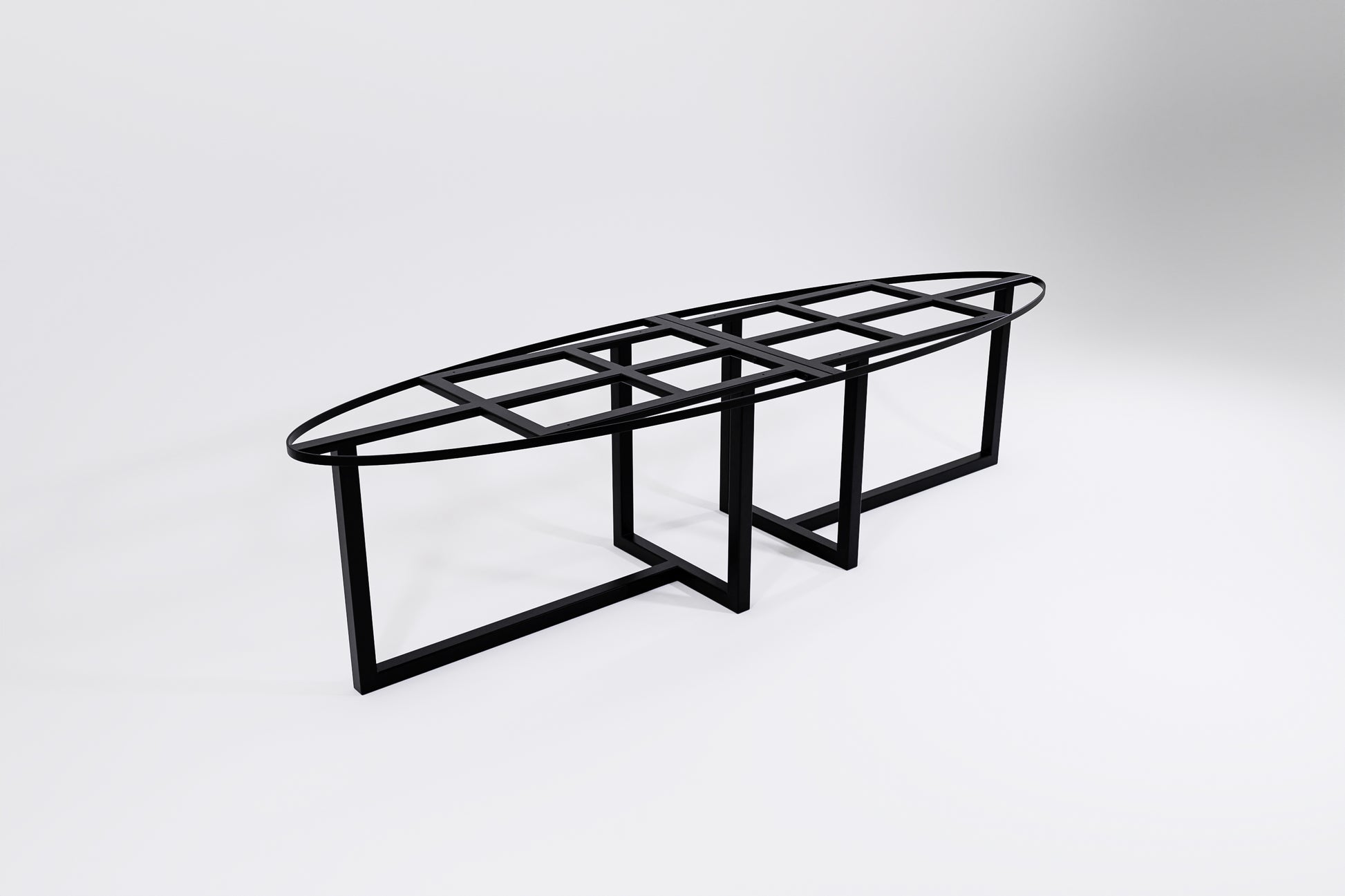 A black modular metal frame designed for use as a table base, with an oval shape and table leg supports.