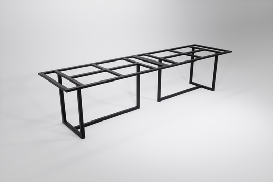 A black modular heavy-duty table base designed to be bolted together, consisting of two sections that form a long table base with multiple legs.