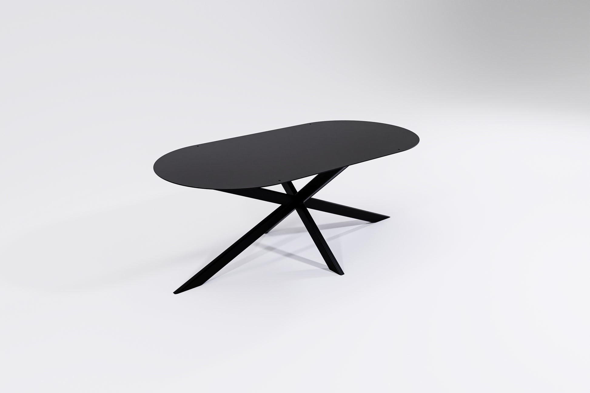 round ends oblong shaped coffee table in black metal with spider legs